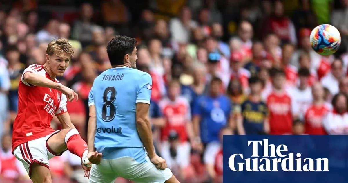 Arsenal player kicking the ball towards Kovacic Arsenal player kicking the ball towards Kovacic