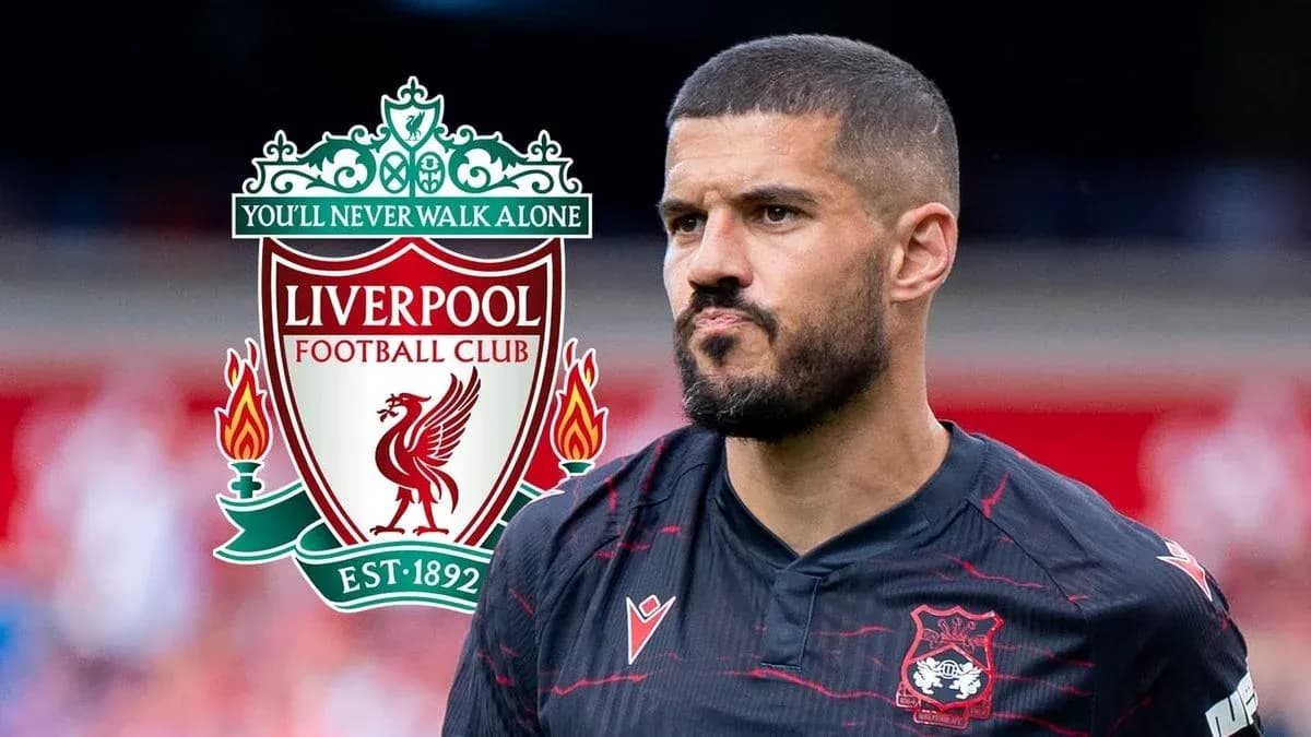 Player in Liverpool kit with club logo background Player in Liverpool kit with club logo background