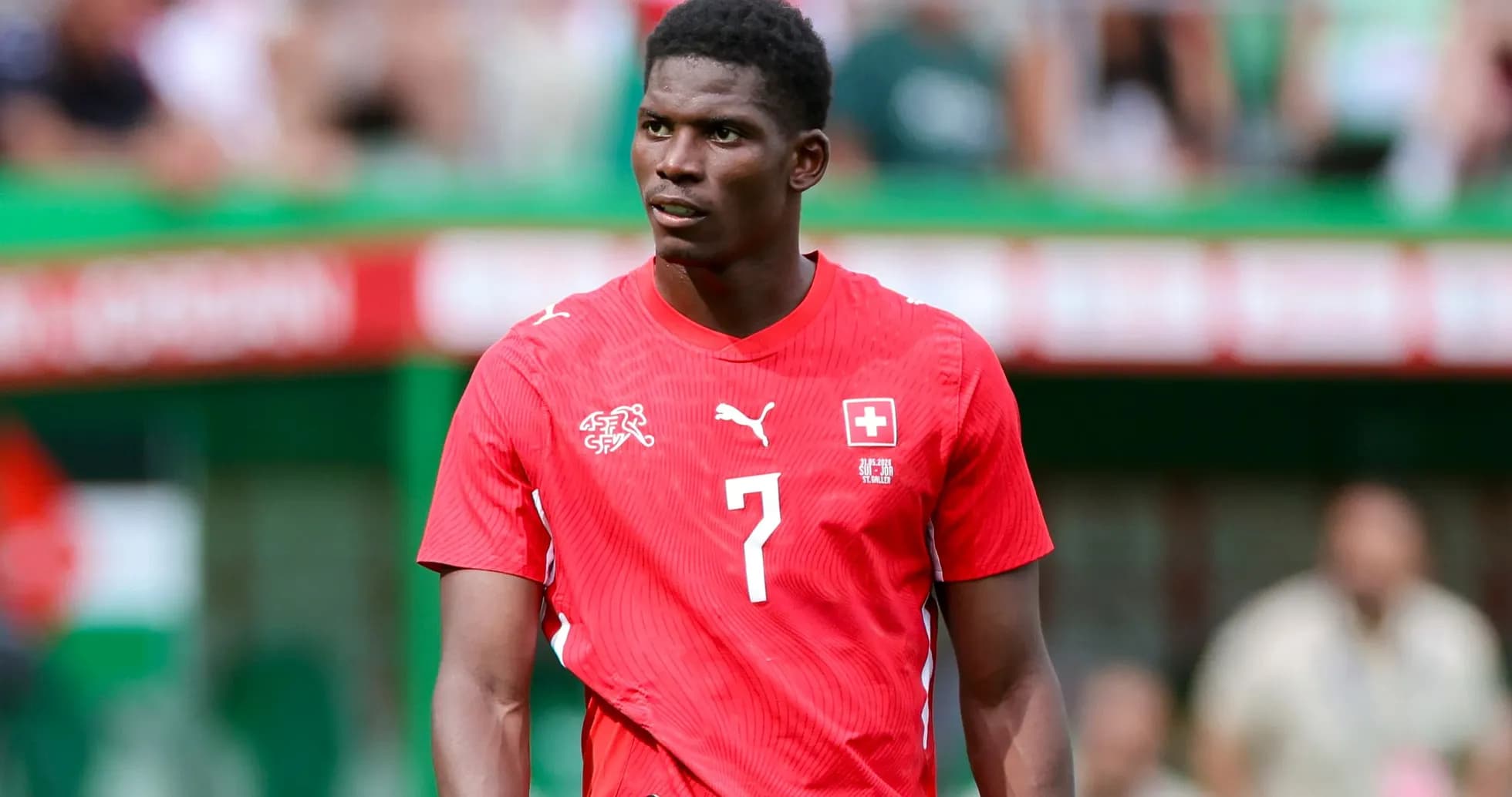Player wearing red jersey during match on field Player wearing red jersey during match on field