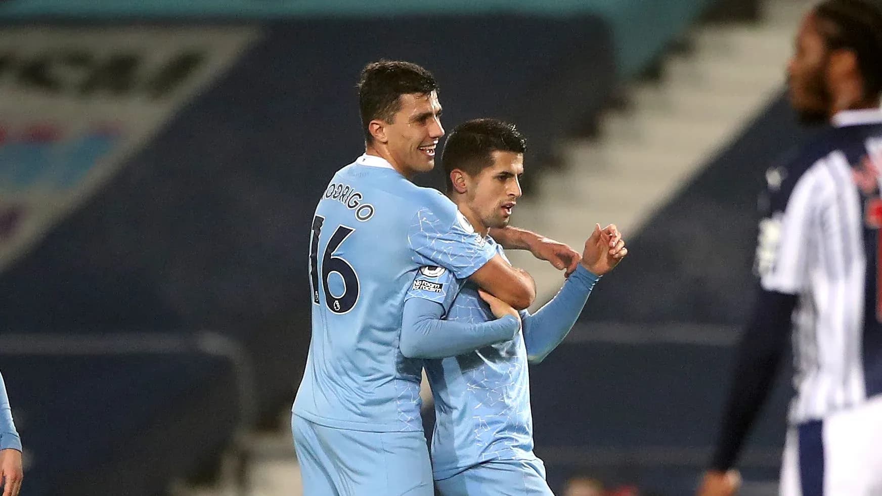 Two players celebrating a goal during match Two players celebrating a goal during match