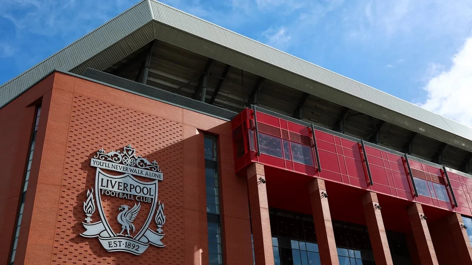 Exterior of Anfield stadium with Liverpool FC crest Exterior of Anfield stadium with Liverpool FC crest