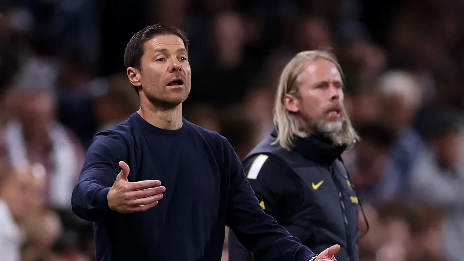 Coaches gesturing on the sidelines during match Coaches gesturing on the sidelines during match