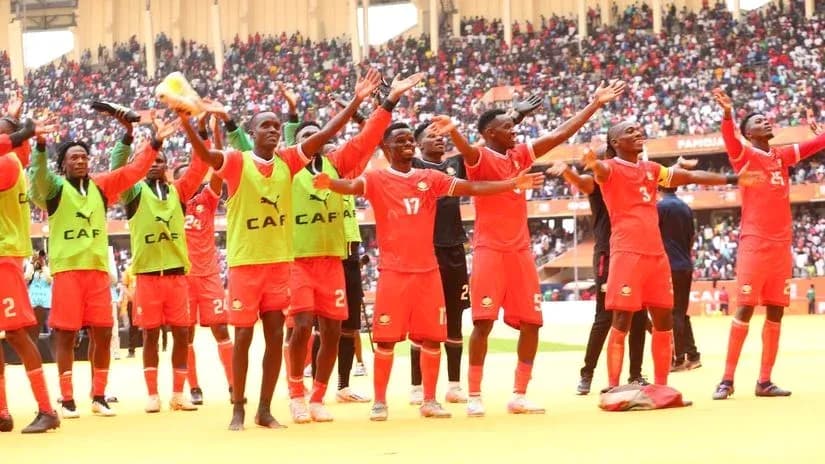 Players celebrating with fans in stadium after match Players celebrating with fans in stadium after match