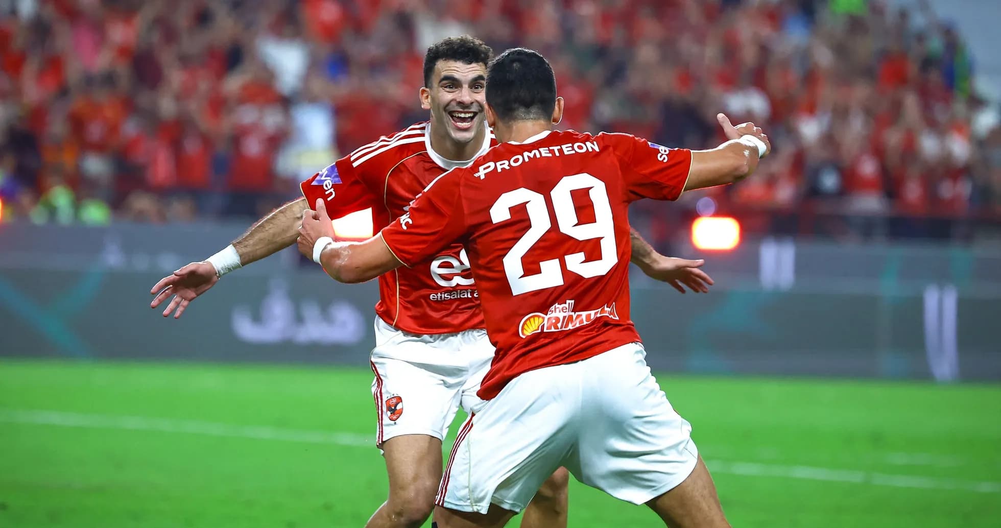 Players celebrating a goal during a football match Players celebrating a goal during a football match