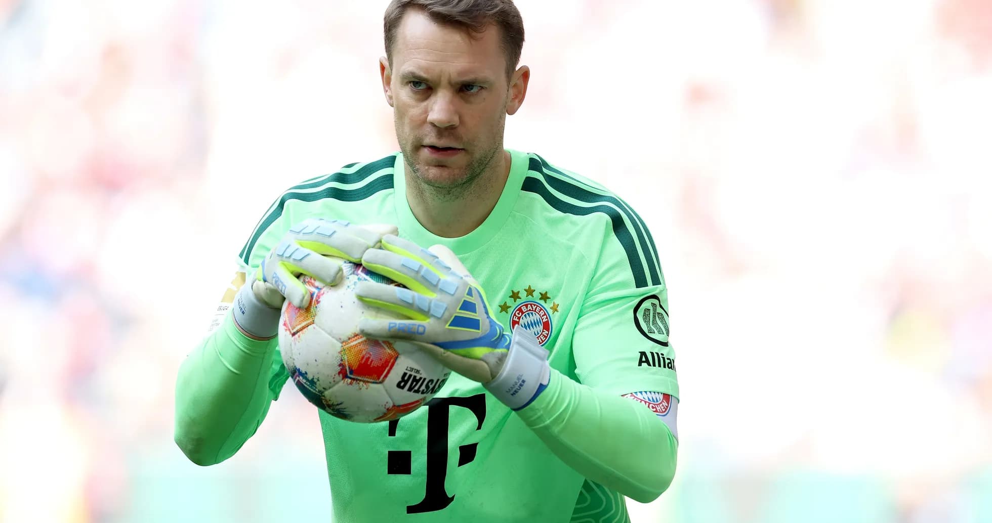 Goalkeeper holding ball before match at stadium Goalkeeper holding ball before match at stadium