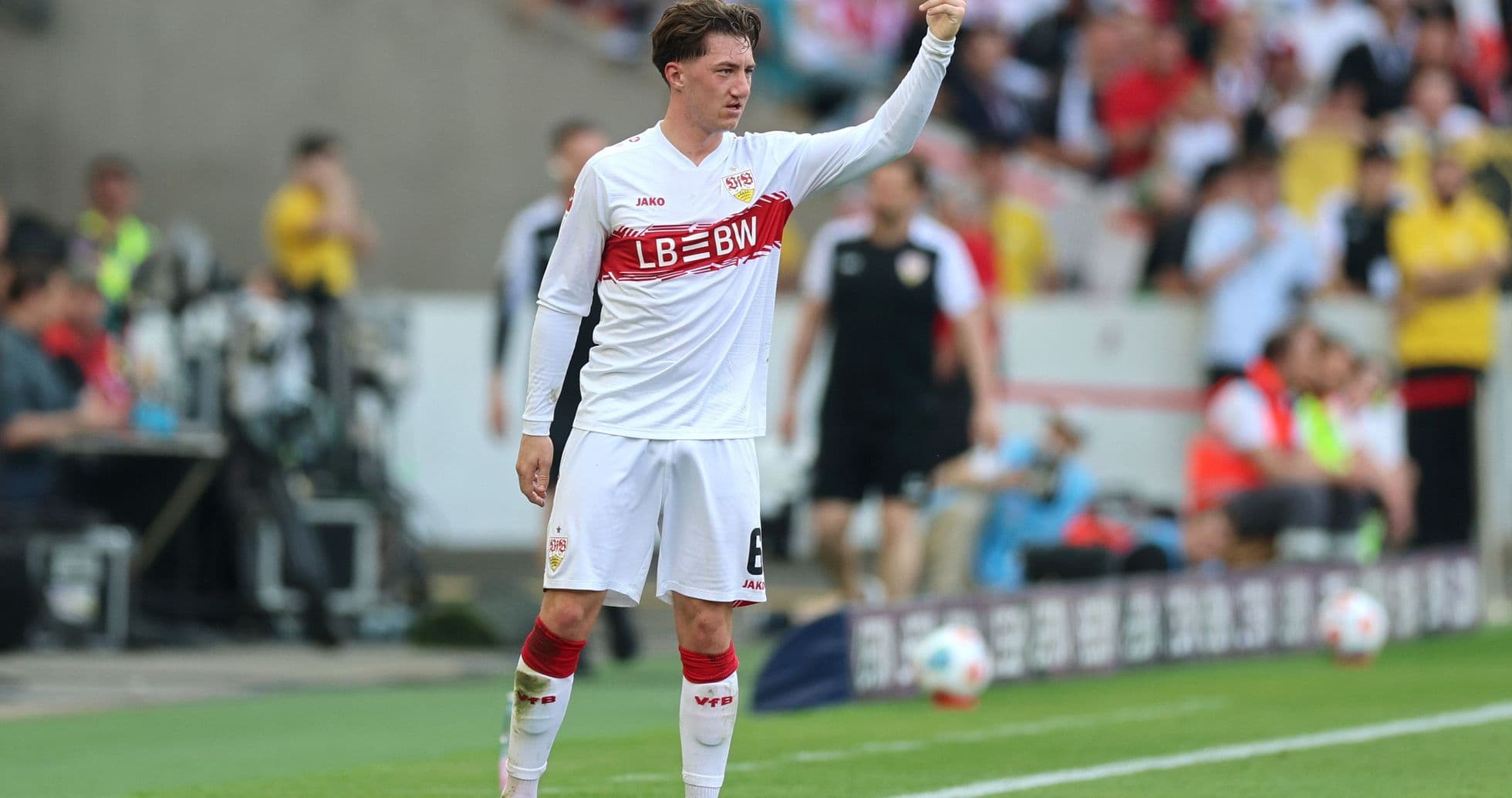 Player signaling during a Bundesliga match Player signaling during a Bundesliga match