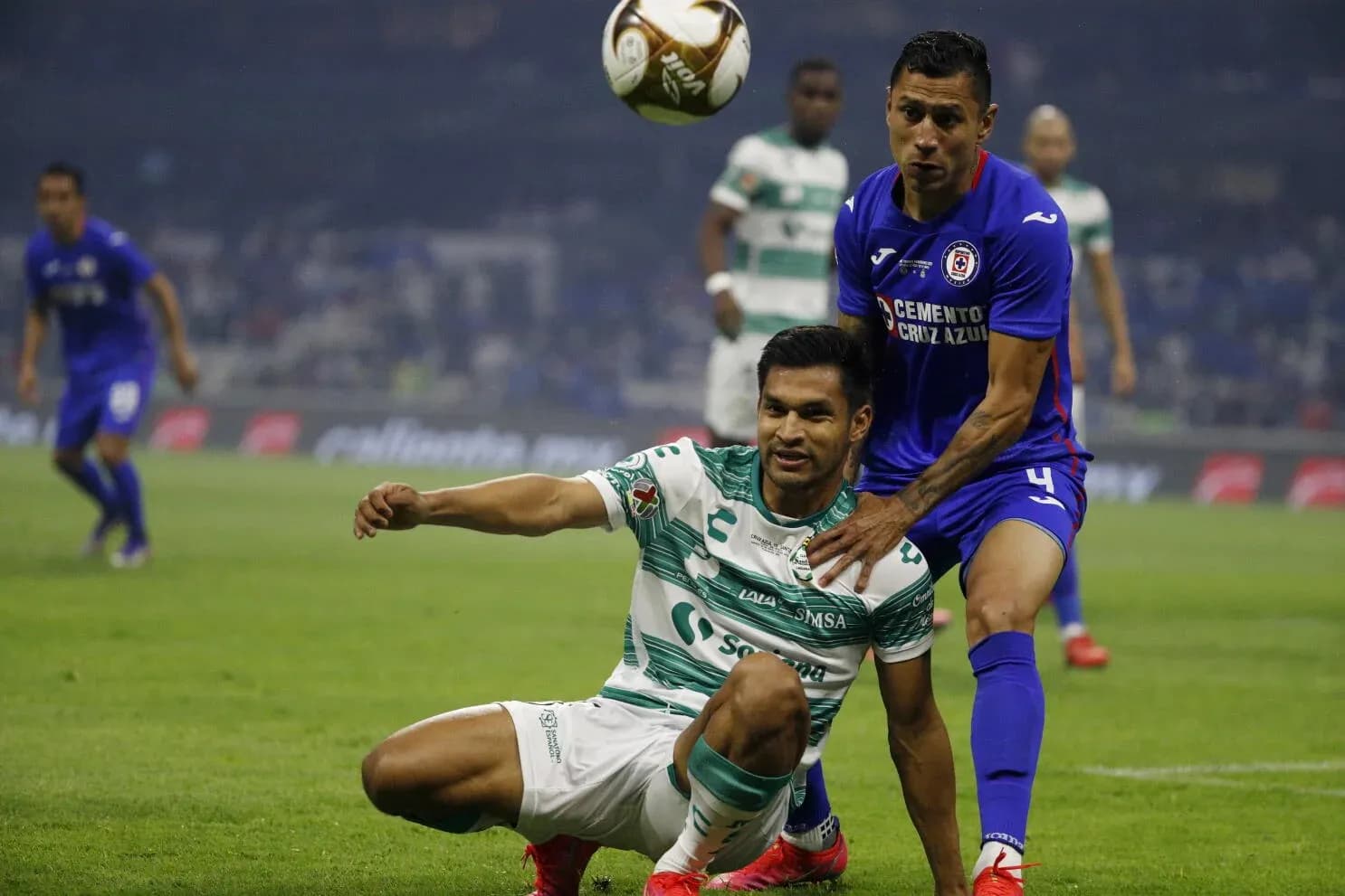 Players contesting for the ball during Liga MX match Players contesting for the ball during Liga MX match