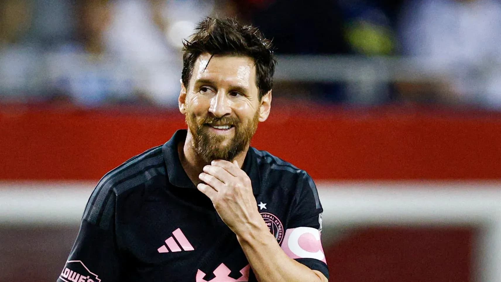 Player smiling during a soccer match Player smiling during a soccer match