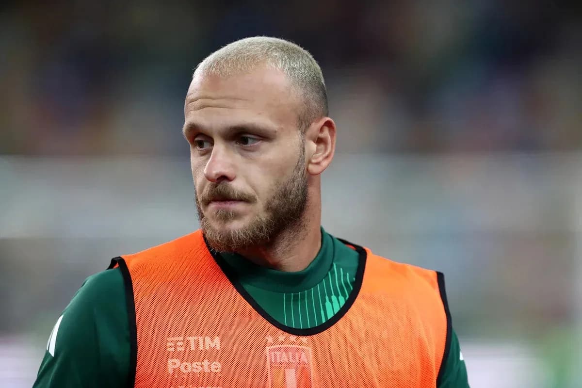 Goalkeeper wearing training bib on the sidelines Goalkeeper wearing training bib on the sidelines