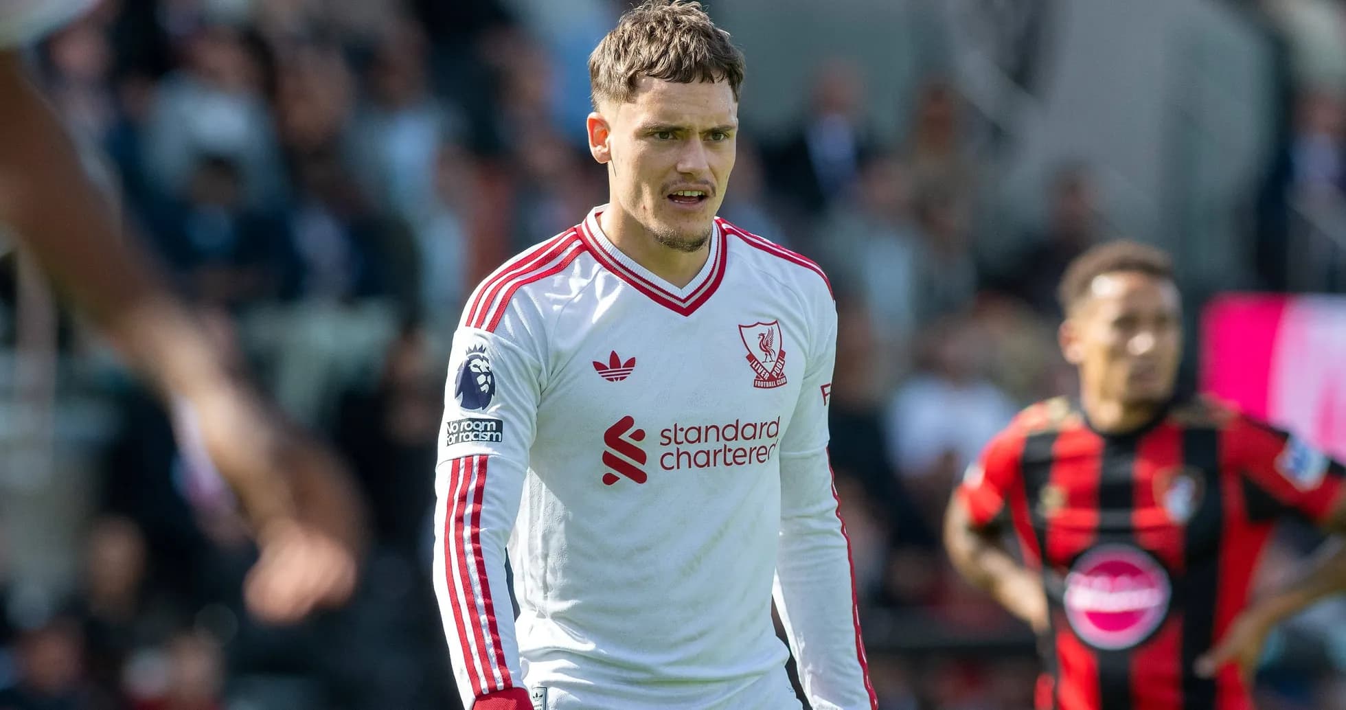 Liverpool player in white kit during match Liverpool player in white kit during match