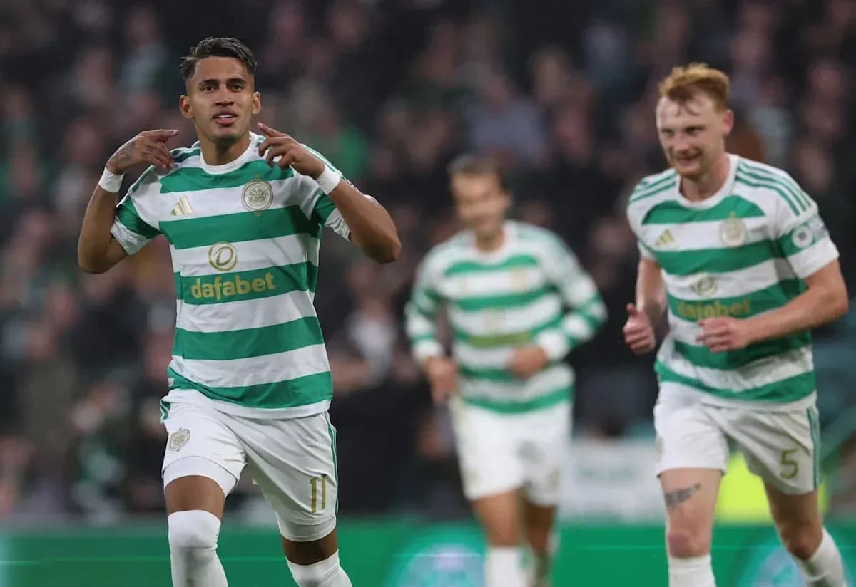 Celtic player celebrating a goal with teammates Celtic player celebrating a goal with teammates