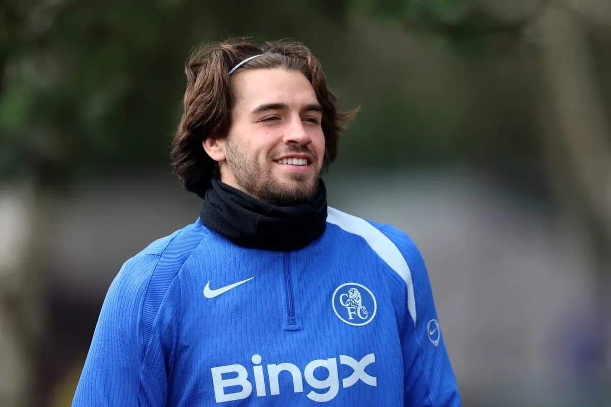 Player smiling during training session in blue kit Player smiling during training session in blue kit