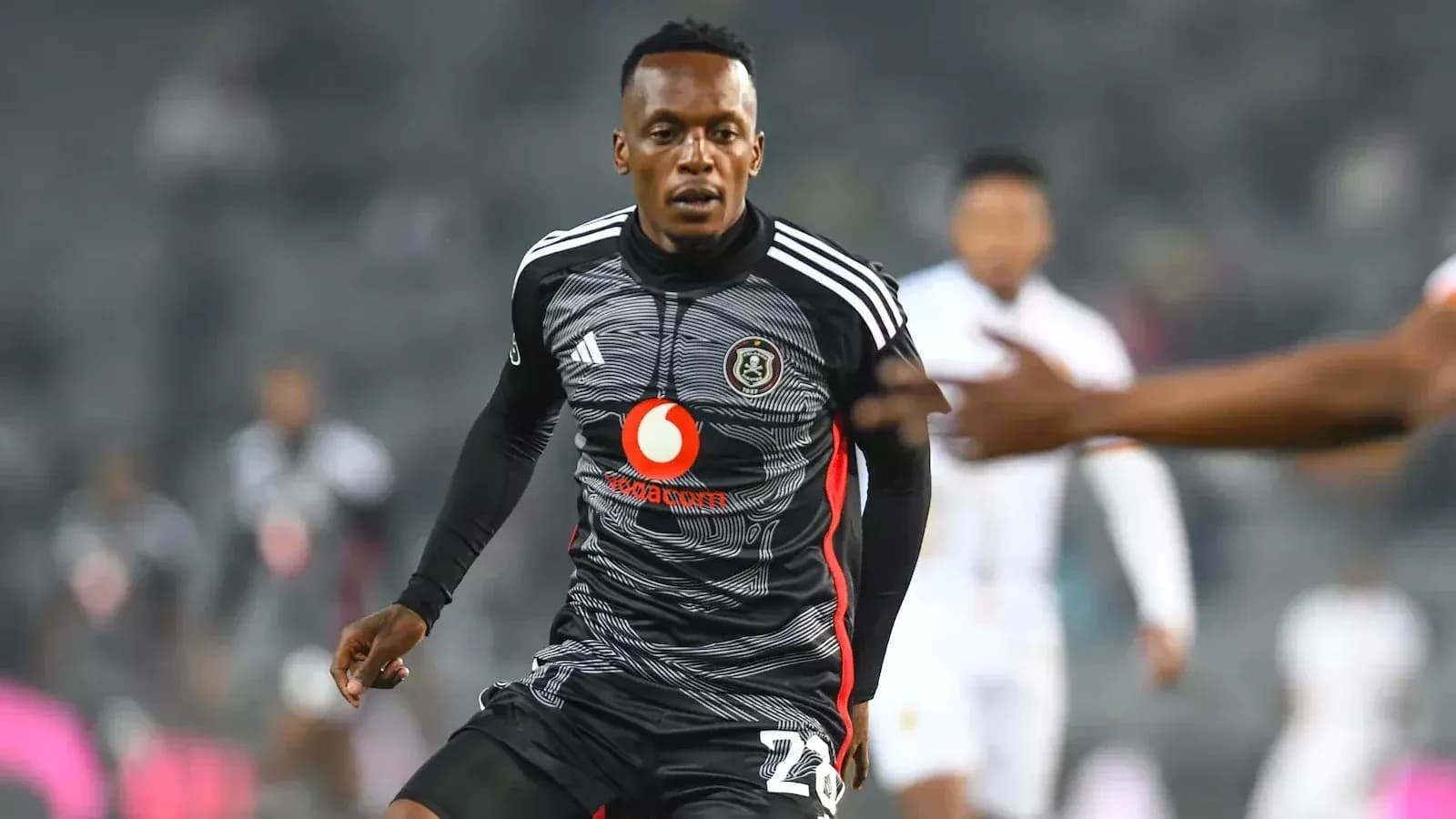 Player in black jersey running on the field Player in black jersey running on the field