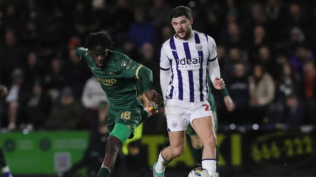 Two players sprinting during a football match Two players sprinting during a football match