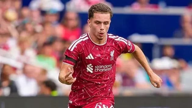 Player running with the ball in Liverpool kit Player running with the ball in Liverpool kit