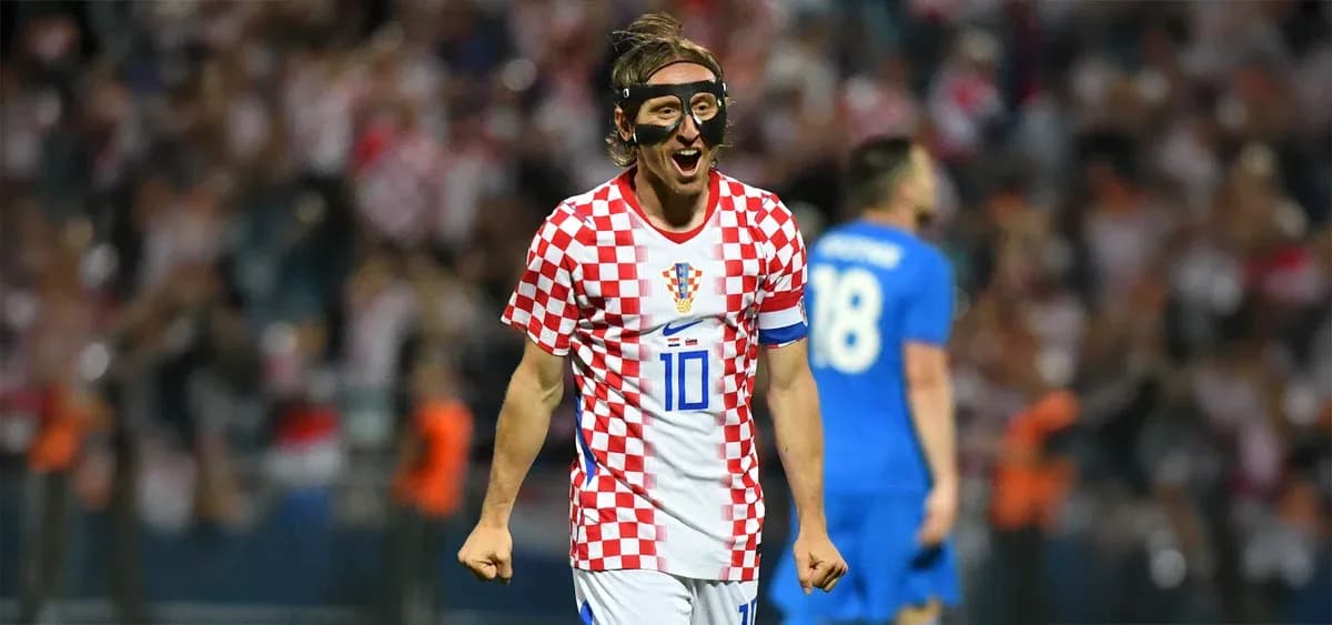 Croatian player celebrating in match with fans Croatian player celebrating in match with fans