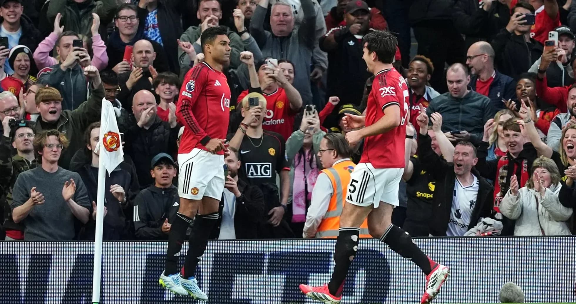 Manchester United players celebrating with fans Manchester United players celebrating with fans