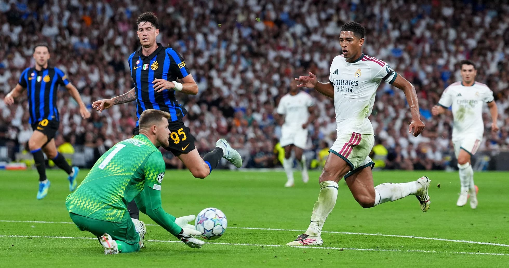 Player attempting to score while goalkeeper makes save Player attempting to score while goalkeeper makes save