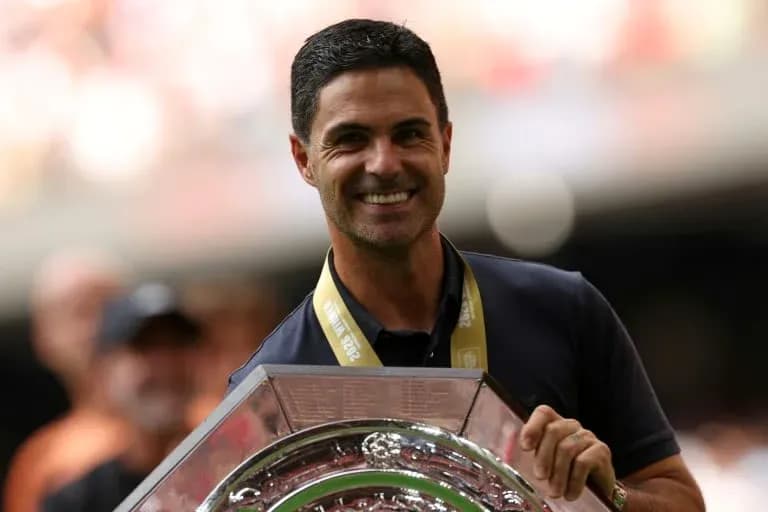 Coach holding trophy during celebration ceremony Coach holding trophy during celebration ceremony
