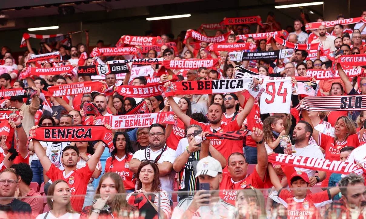 Benfica fans holding scarves in the stadium Benfica fans holding scarves in the stadium