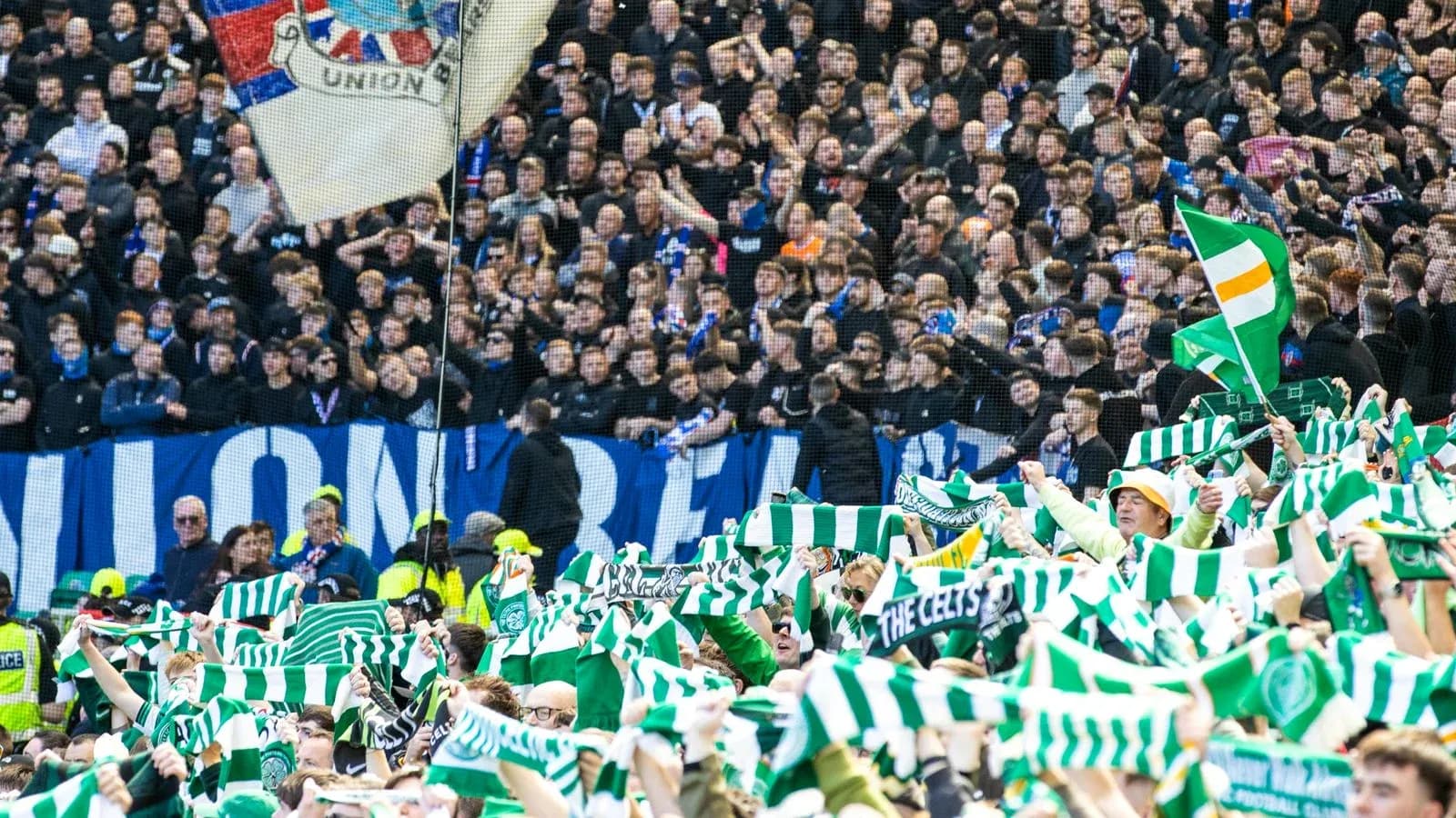 Fans waving scarves in a football stadium Fans waving scarves in a football stadium