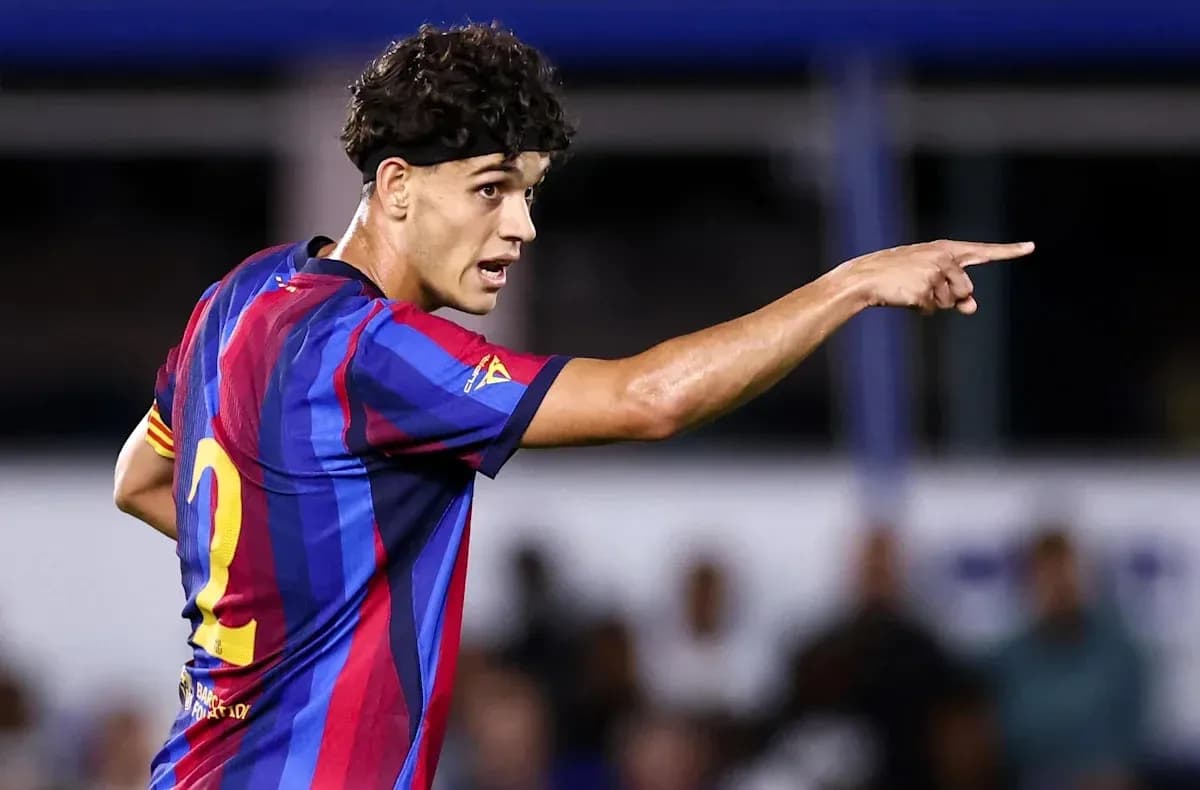 Player in Barcelona jersey directing teammates during match Player in Barcelona jersey directing teammates during match