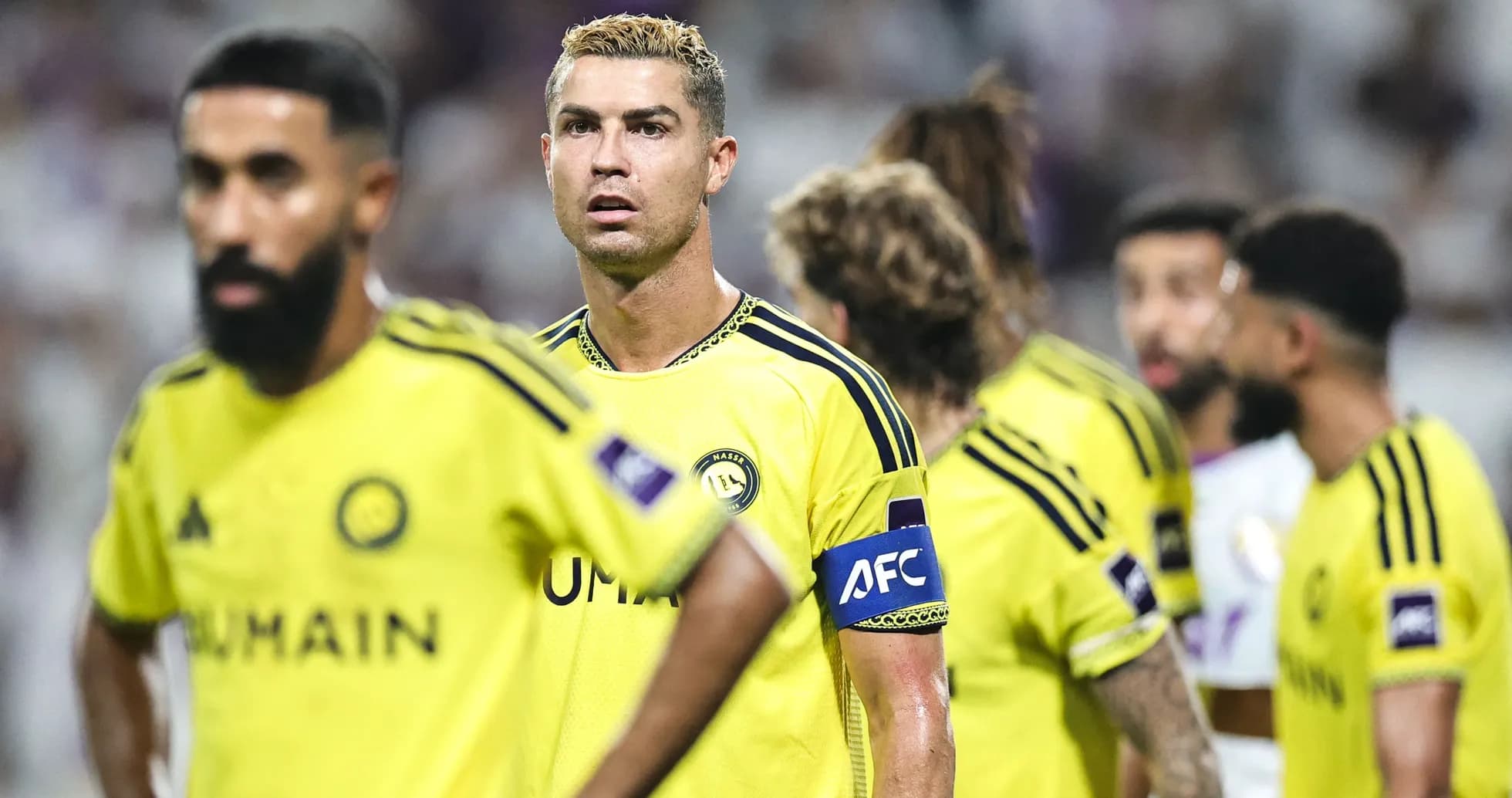 Cristiano Ronaldo and teammates in yellow jerseys during match Cristiano Ronaldo and teammates in yellow jerseys during match