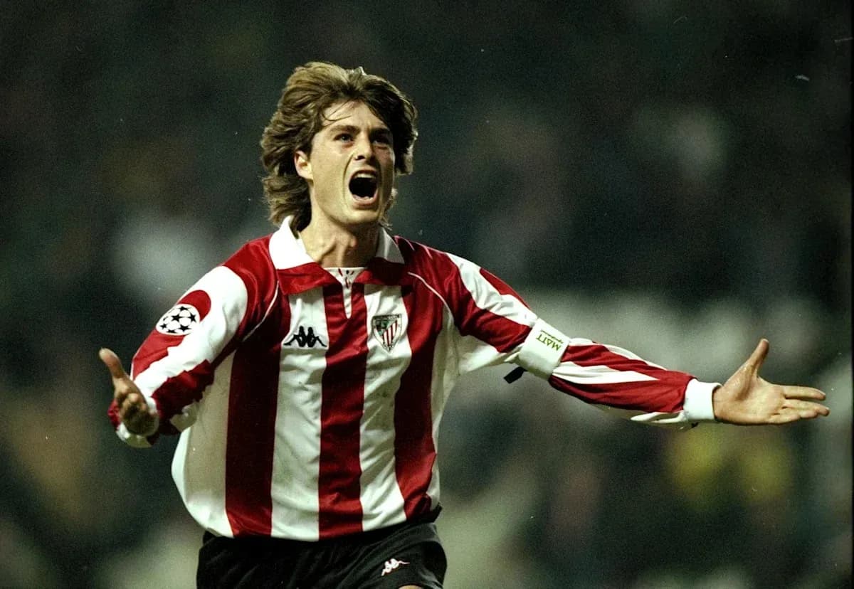 Player celebrating with arms raised in stadium Player celebrating with arms raised in stadium