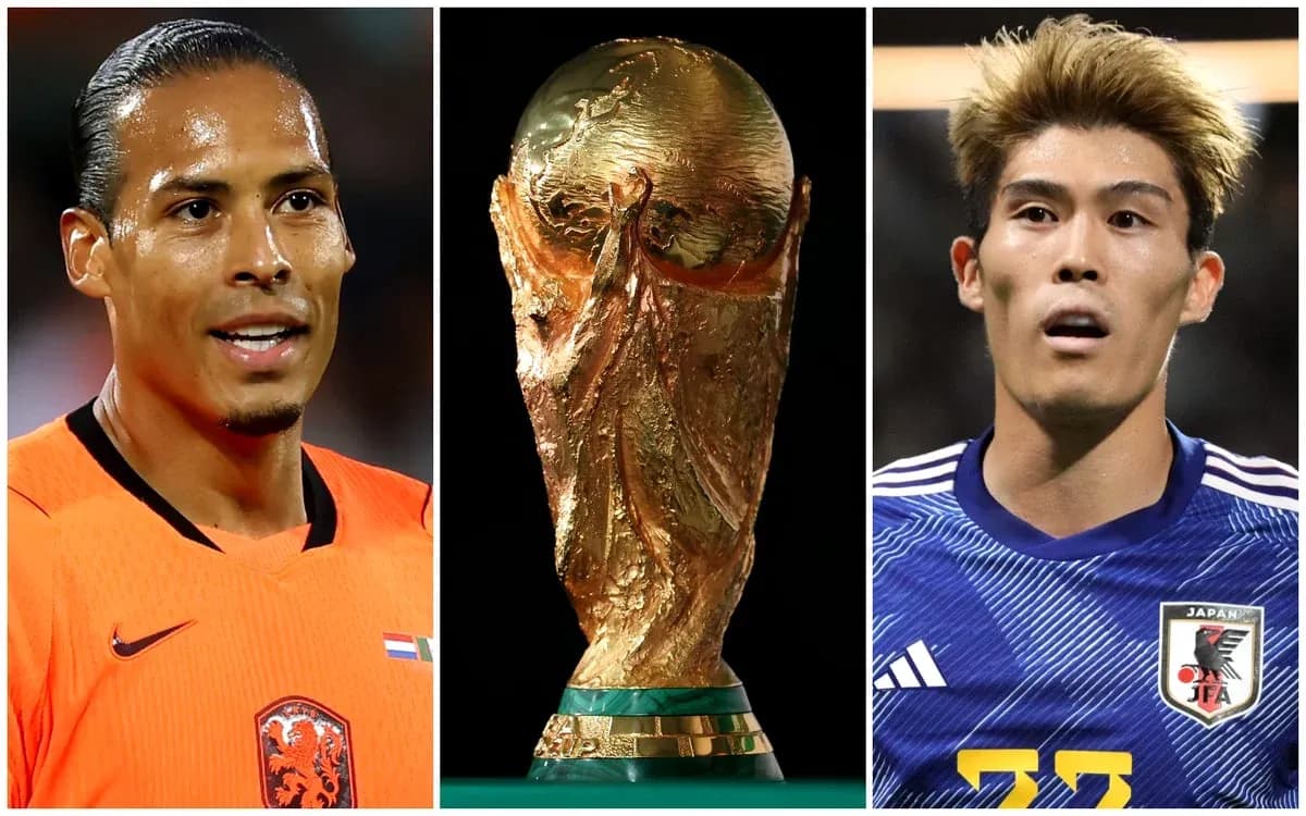 Virgil van Dijk and Japanese player with World Cup trophy Virgil van Dijk and Japanese player with World Cup trophy