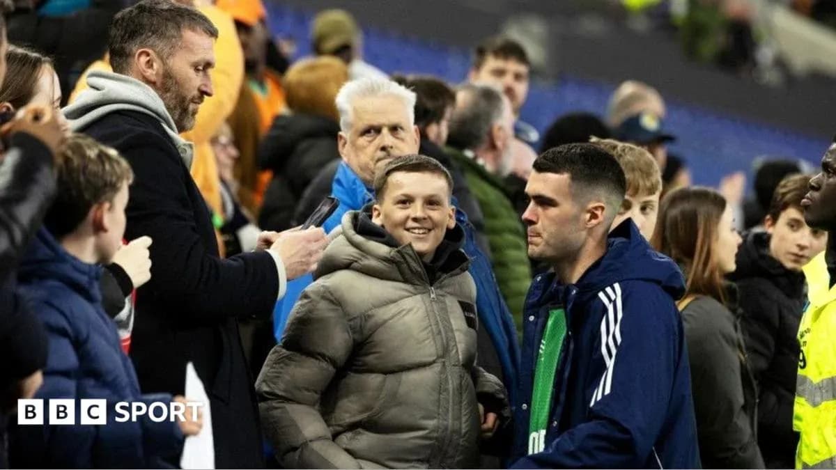 Fans interacting in the stands after a match Fans interacting in the stands after a match