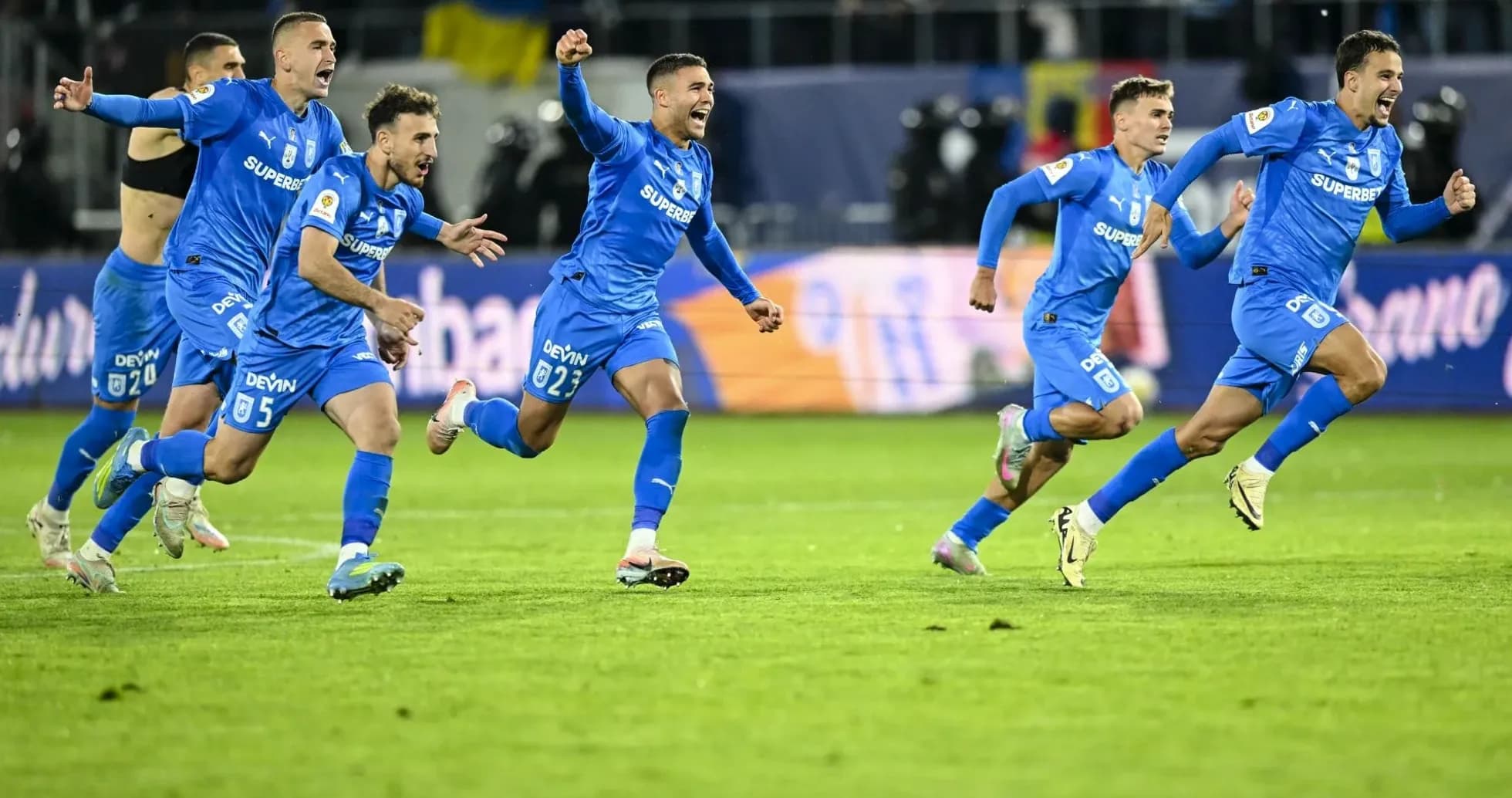 Universitatea Craiova players celebrating a goal Universitatea Craiova players celebrating a goal