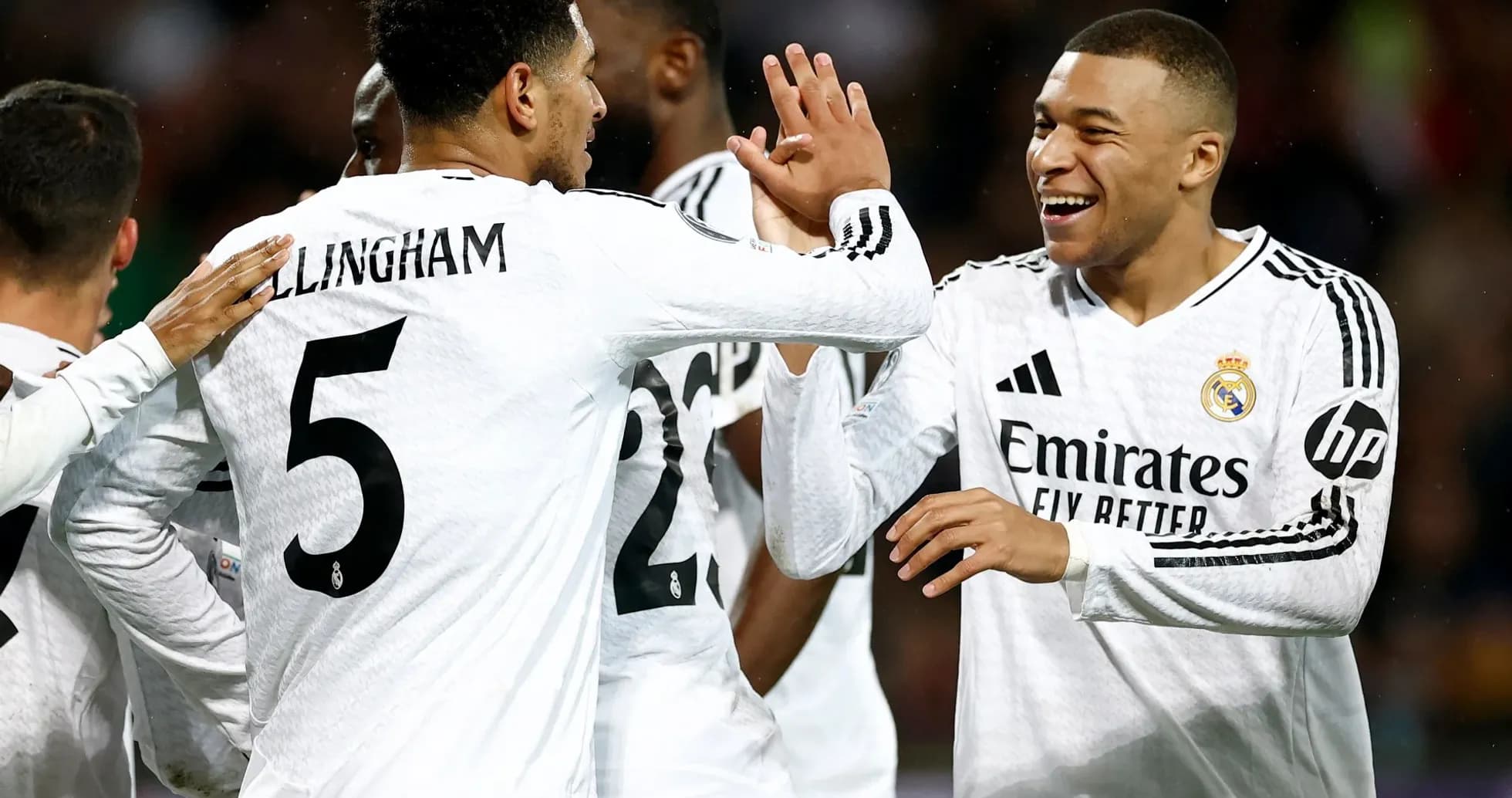 Real Madrid players celebrating a goal Real Madrid players celebrating a goal