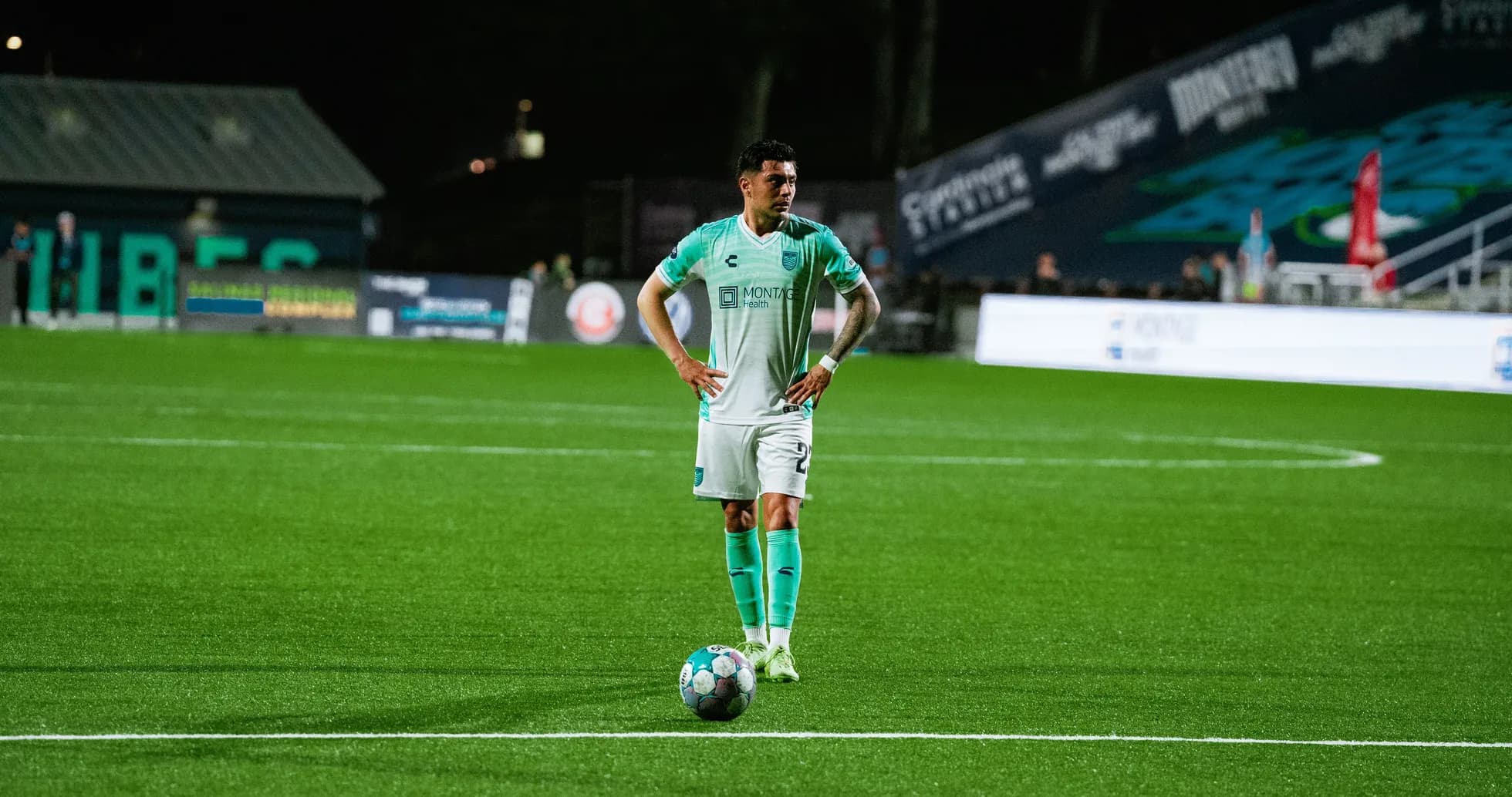 Player preparing for a free kick during match Player preparing for a free kick during match