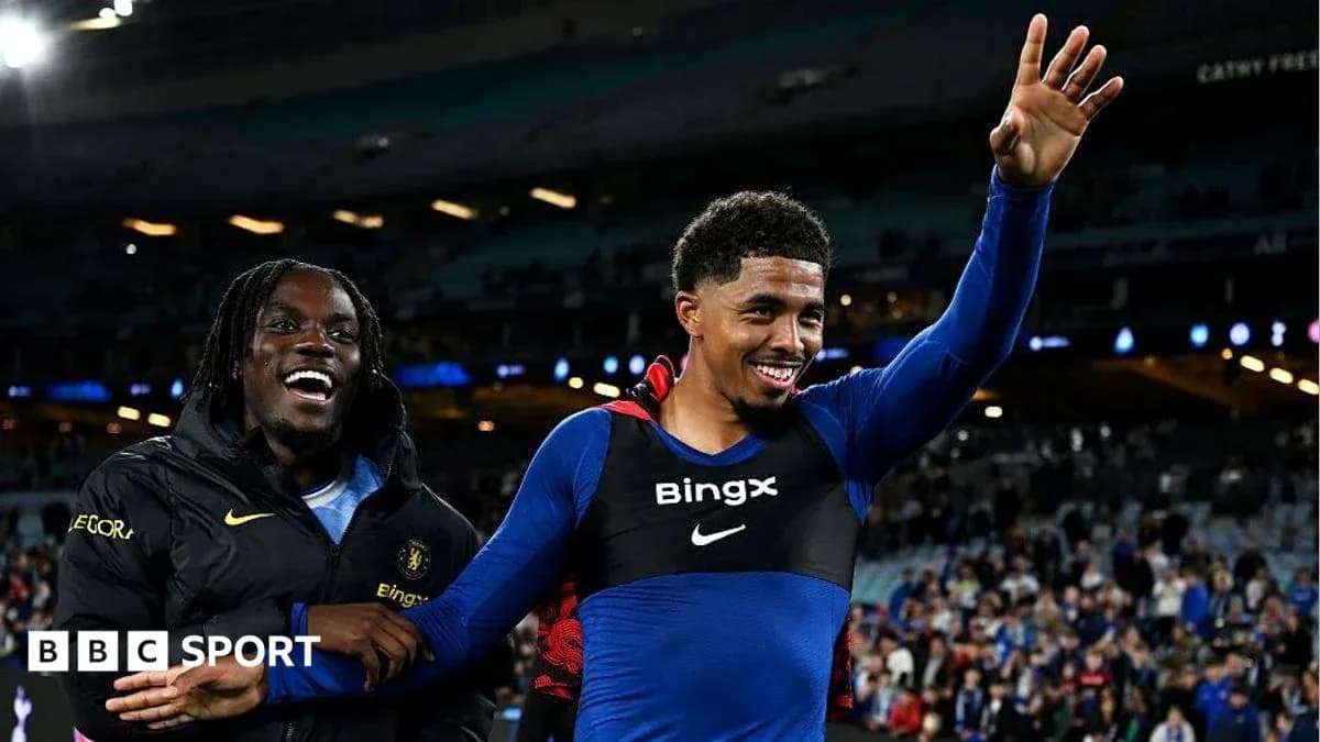 Two players celebrating on the pitch after match Two players celebrating on the pitch after match