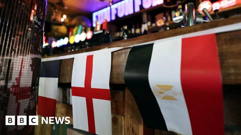 Flags of England, France, and Egypt displayed in pub Flags of England, France, and Egypt displayed in pub