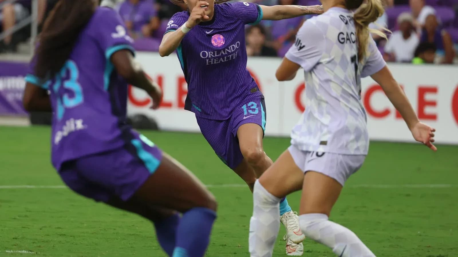 Orlando Pride player dribbling past Portland Thorns defender Orlando Pride player dribbling past Portland Thorns defender