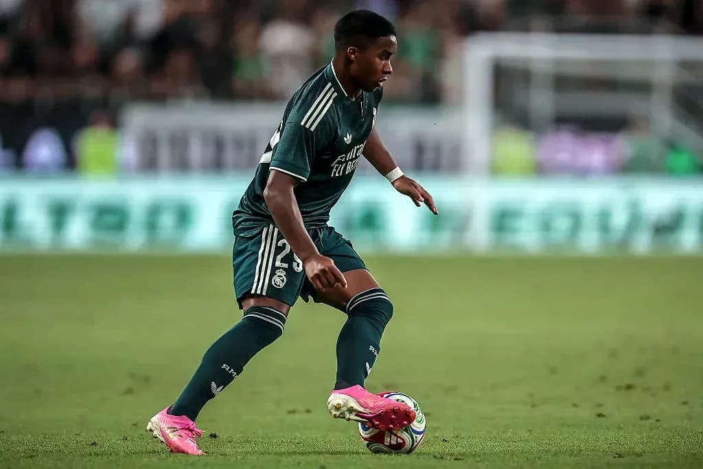 Player dribbling the ball during match for Real Madrid Player dribbling the ball during match for Real Madrid