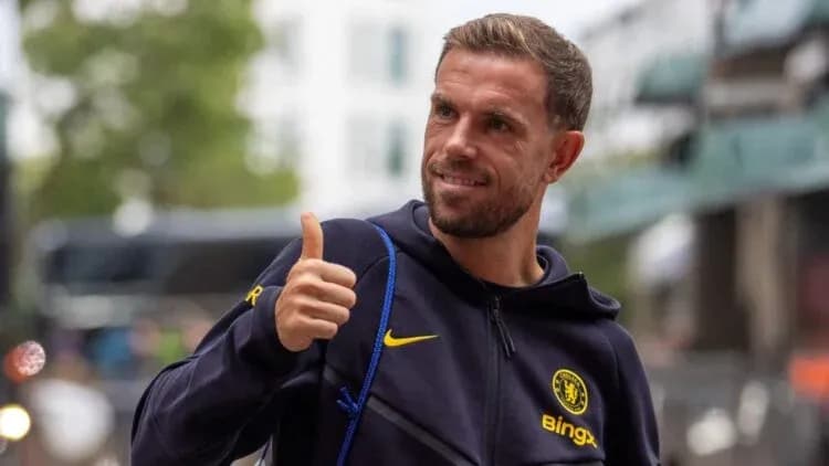 Player giving thumbs up while wearing Chelsea gear Player giving thumbs up while wearing Chelsea gear