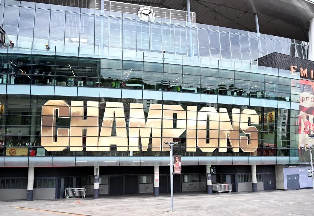 Exterior of stadium with 'CHAMPIONS' displayed prominently Exterior of stadium with 'CHAMPIONS' displayed prominently