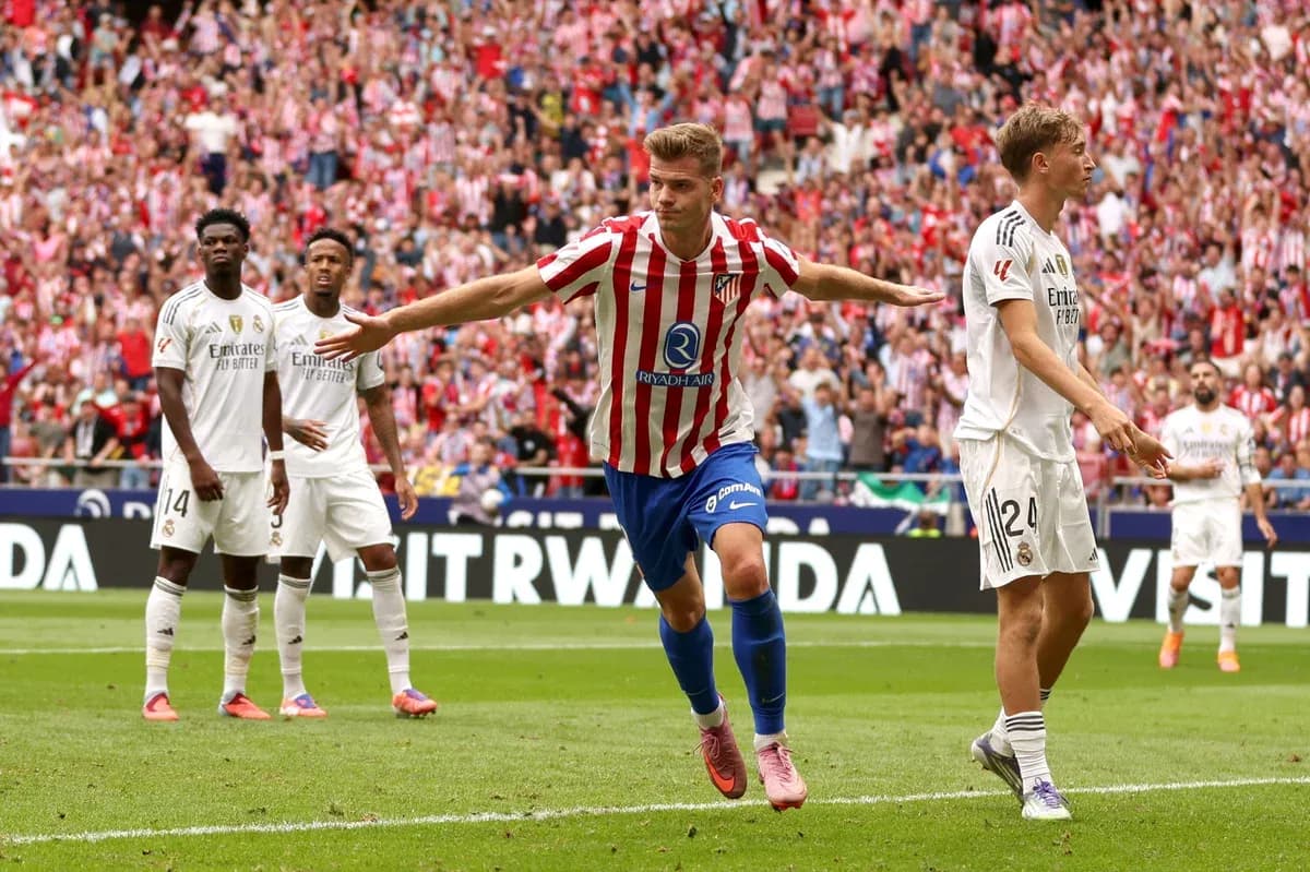 Atletico player celebrating goal against Real Madrid Atletico player celebrating goal against Real Madrid