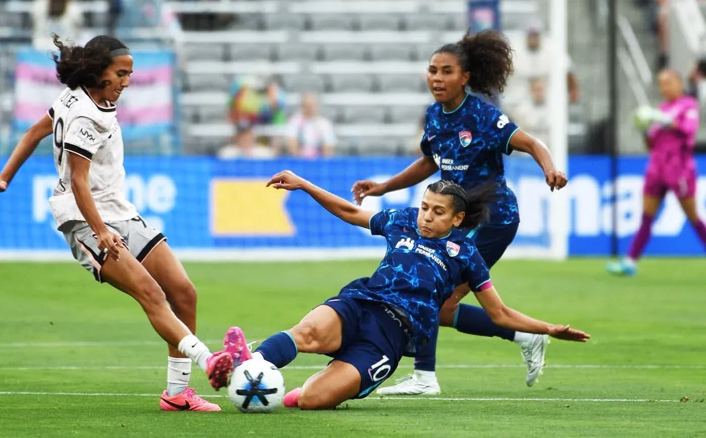 San Diego Wave player tackling Kansas City player San Diego Wave player tackling Kansas City player