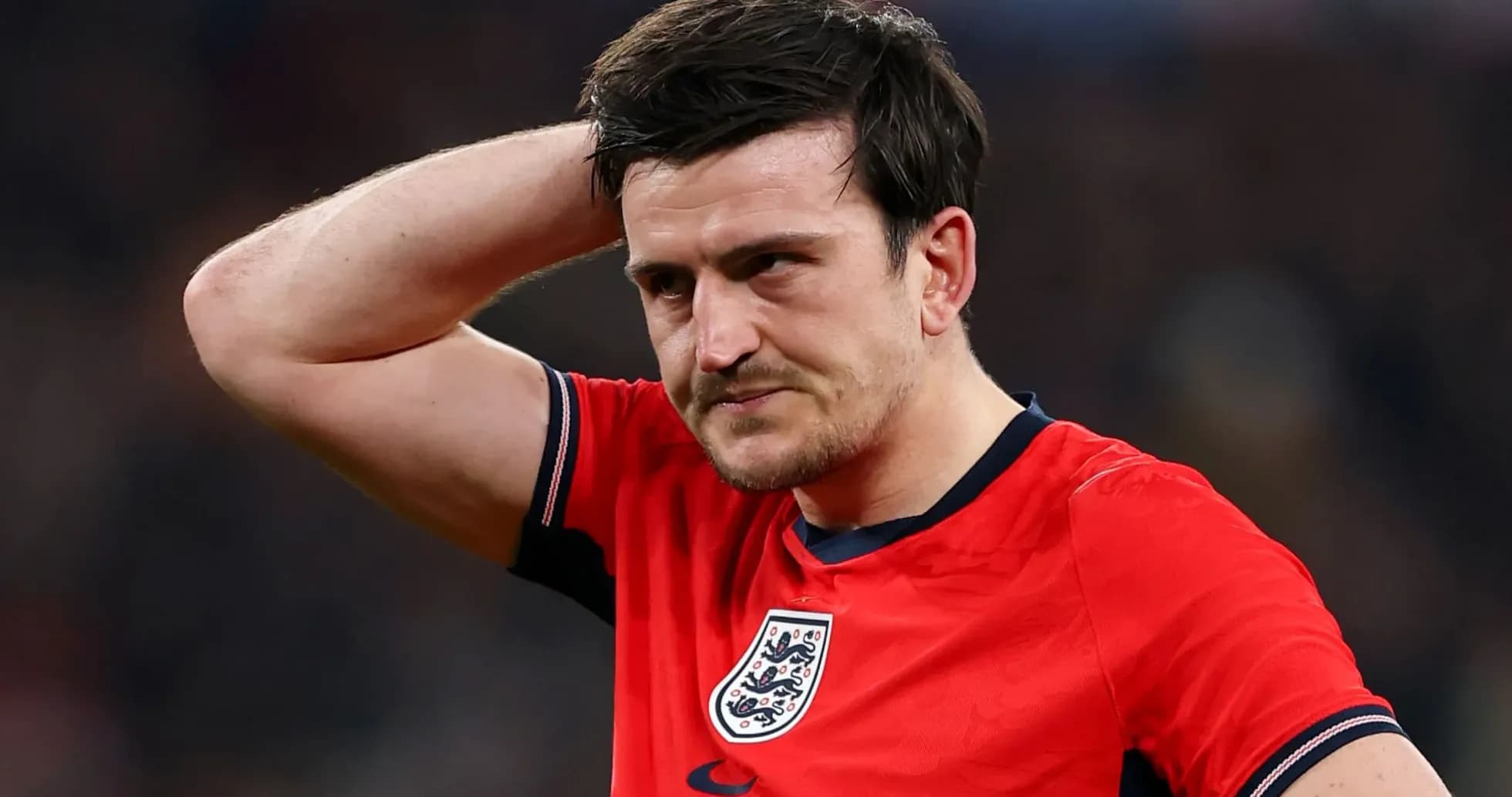 Player holding head in frustration during match Player holding head in frustration during match