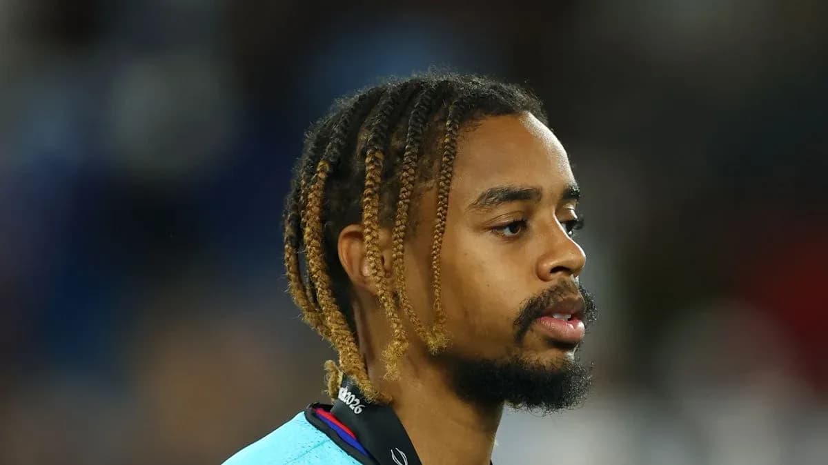 Player walking on the field with braided hair Player walking on the field with braided hair