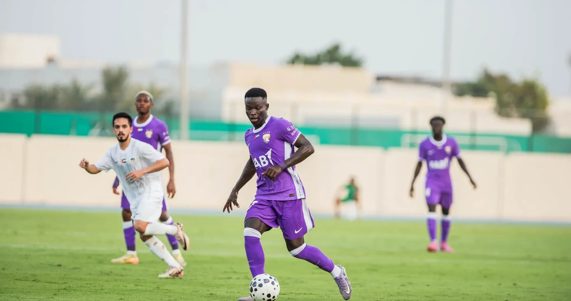 Al Ain U23 player dribbling the ball during match Al Ain U23 player dribbling the ball during match