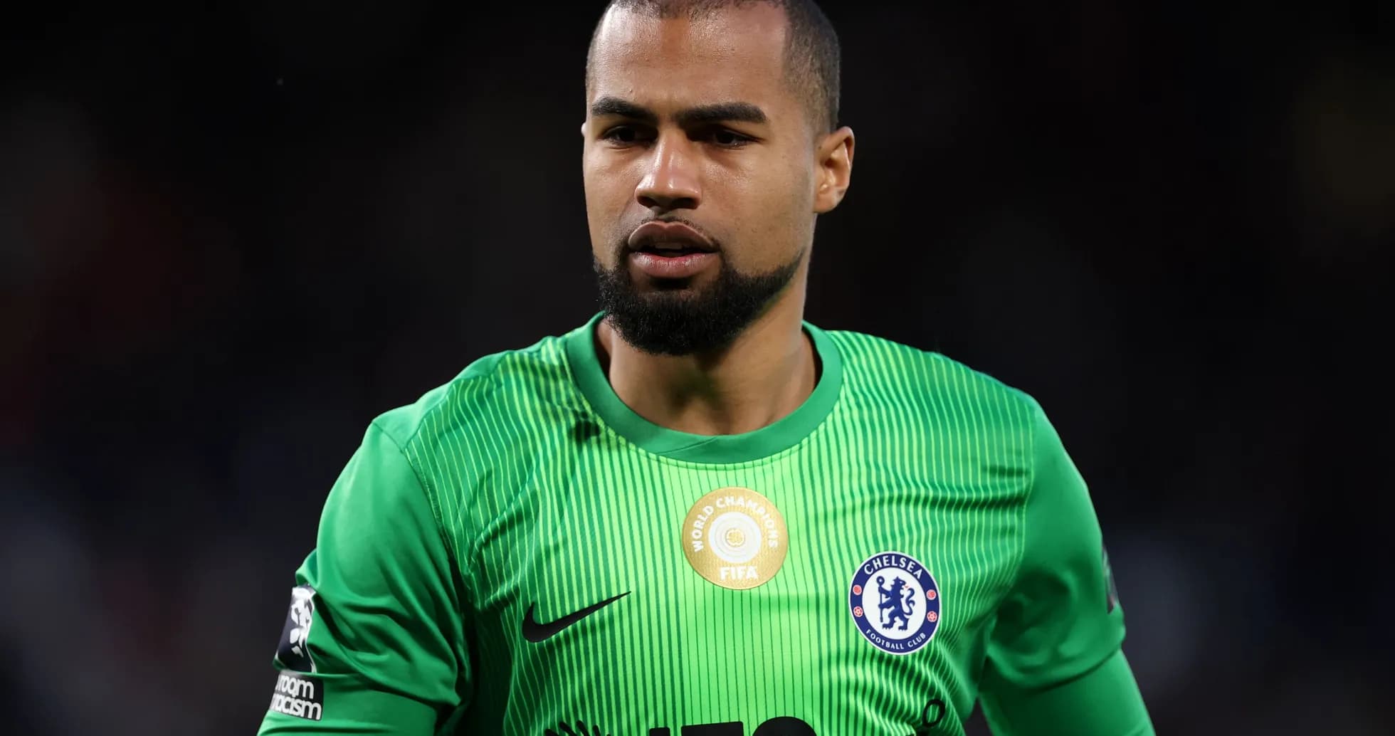 Goalkeeper in green jersey during match Goalkeeper in green jersey during match