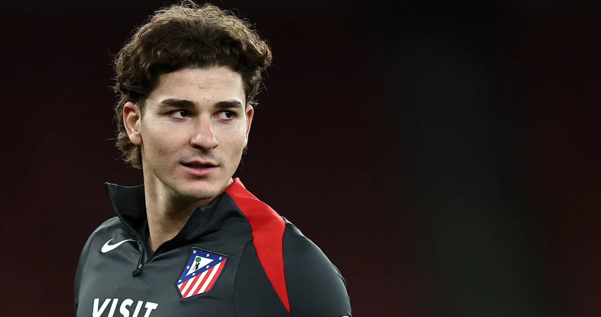 Player in Atlético Madrid training gear looking sideways Player in Atlético Madrid training gear looking sideways