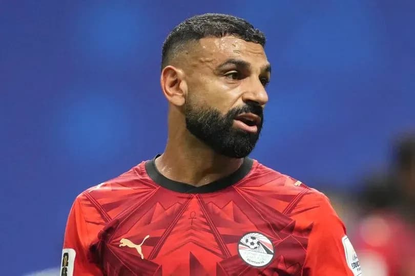 Player in red jersey during football match Player in red jersey during football match