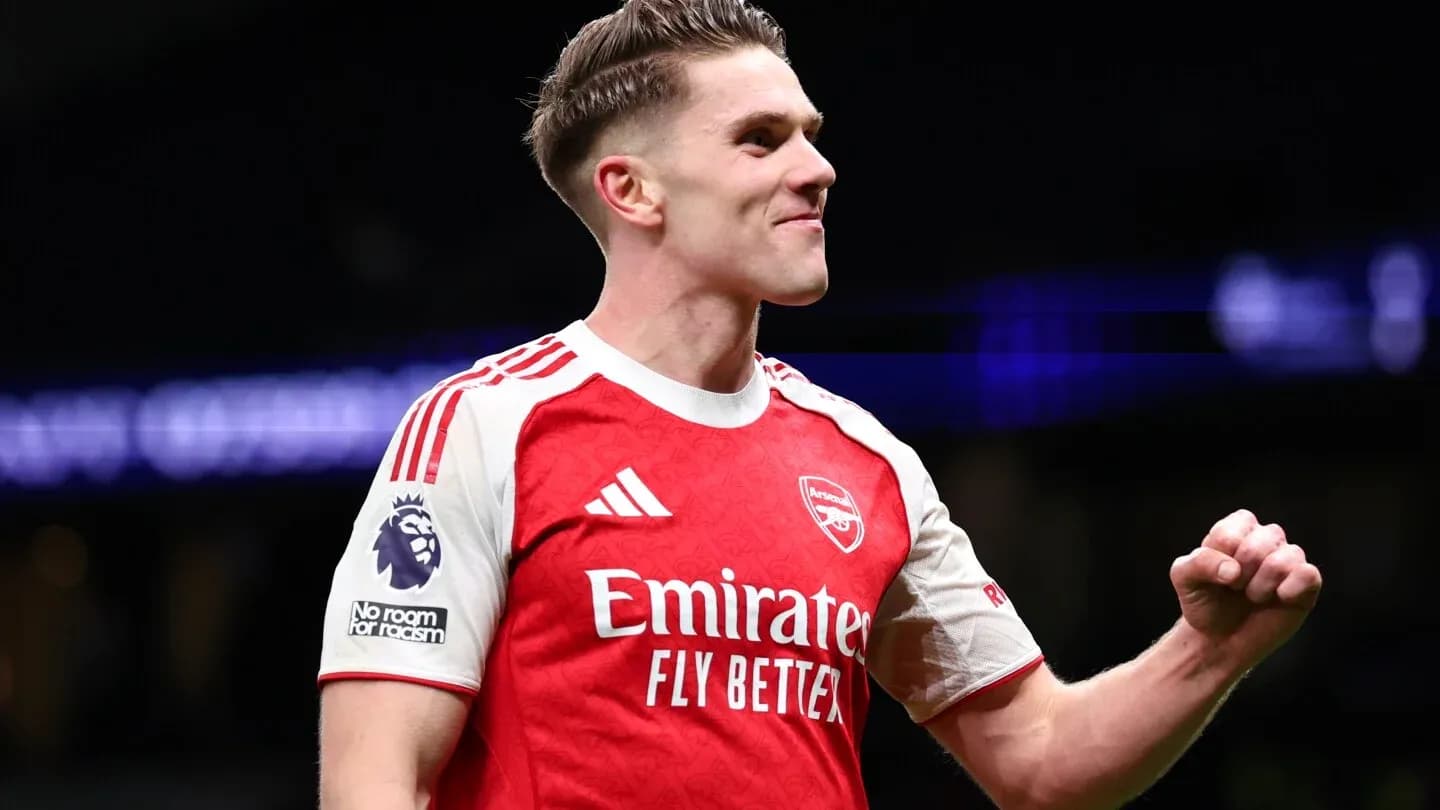 Player celebrating in Arsenal home kit Player celebrating in Arsenal home kit