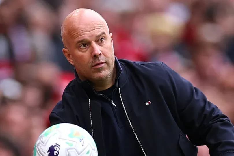 Coach observing the game while holding a ball Coach observing the game while holding a ball