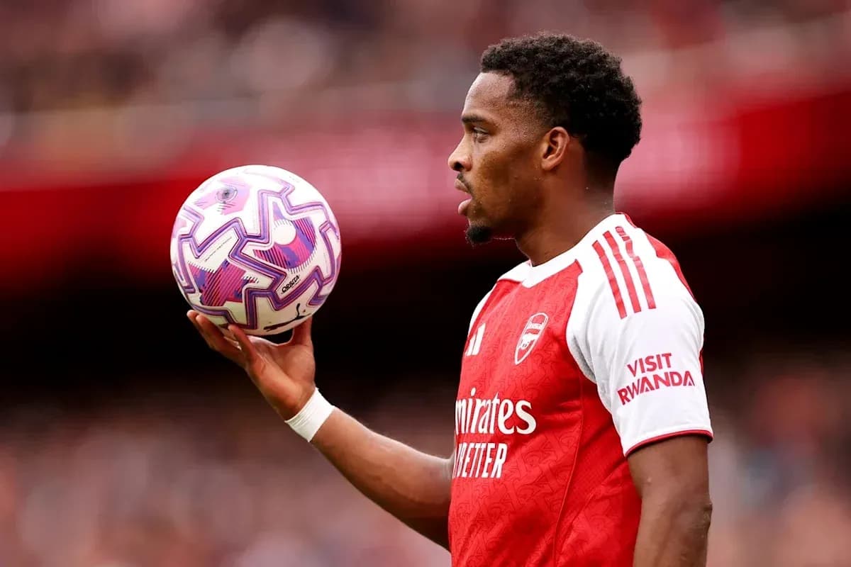 Player holding a soccer ball during match preparation Player holding a soccer ball during match preparation
